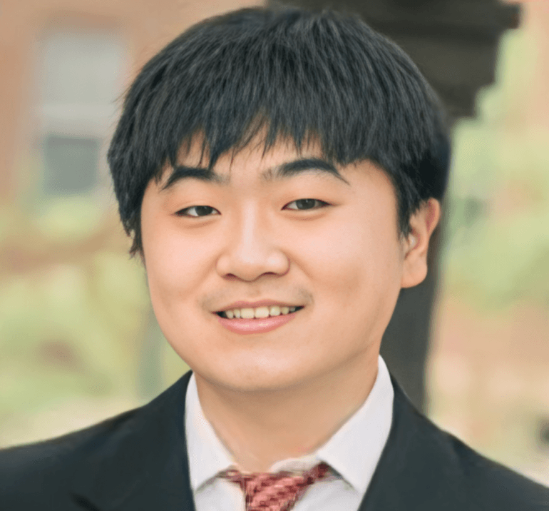 Professional headshot of Mickey Zheng